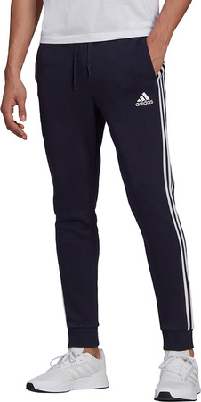 Spodnie męskie adidas Essentials Fleece Tapered Cuff 3-Band Pants granatowe GK8823