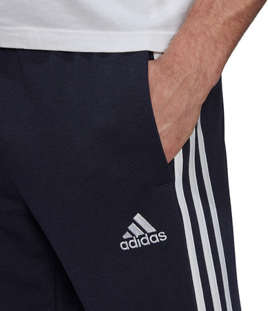 Spodnie męskie adidas Essentials Tapered Elastic Cuff 3 Stripes Pant granatowe GK8830