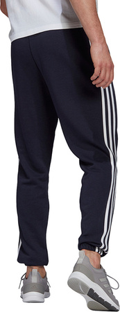 Spodnie męskie adidas Essentials Tapered Elastic Cuff 3 Stripes Pant granatowe GK8830