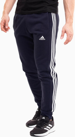 Spodnie męskie adidas Essentials French Terry Tapered Cuff 3-Stripes granatowe IC9406